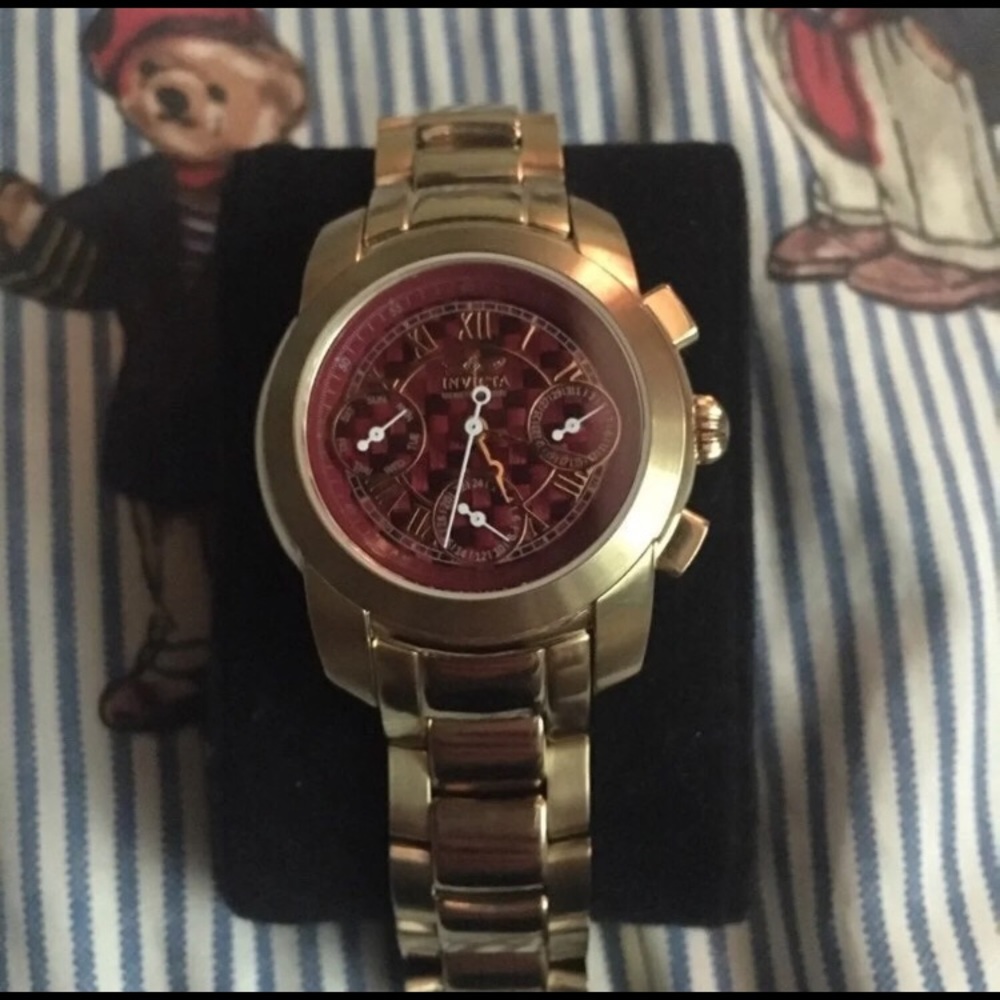 Women’s red and gold mid size invicta watch